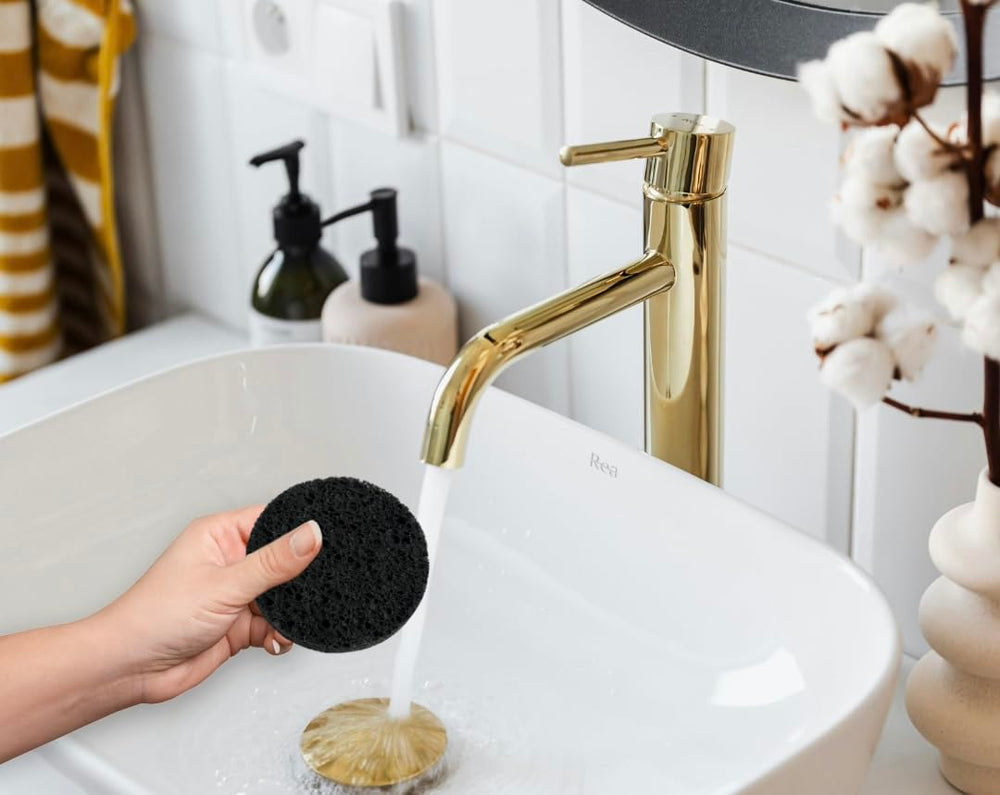 Bamboo Charcoal Cleansing Sponge material closeup reveals wood pulp fibers and charcoal infusion.