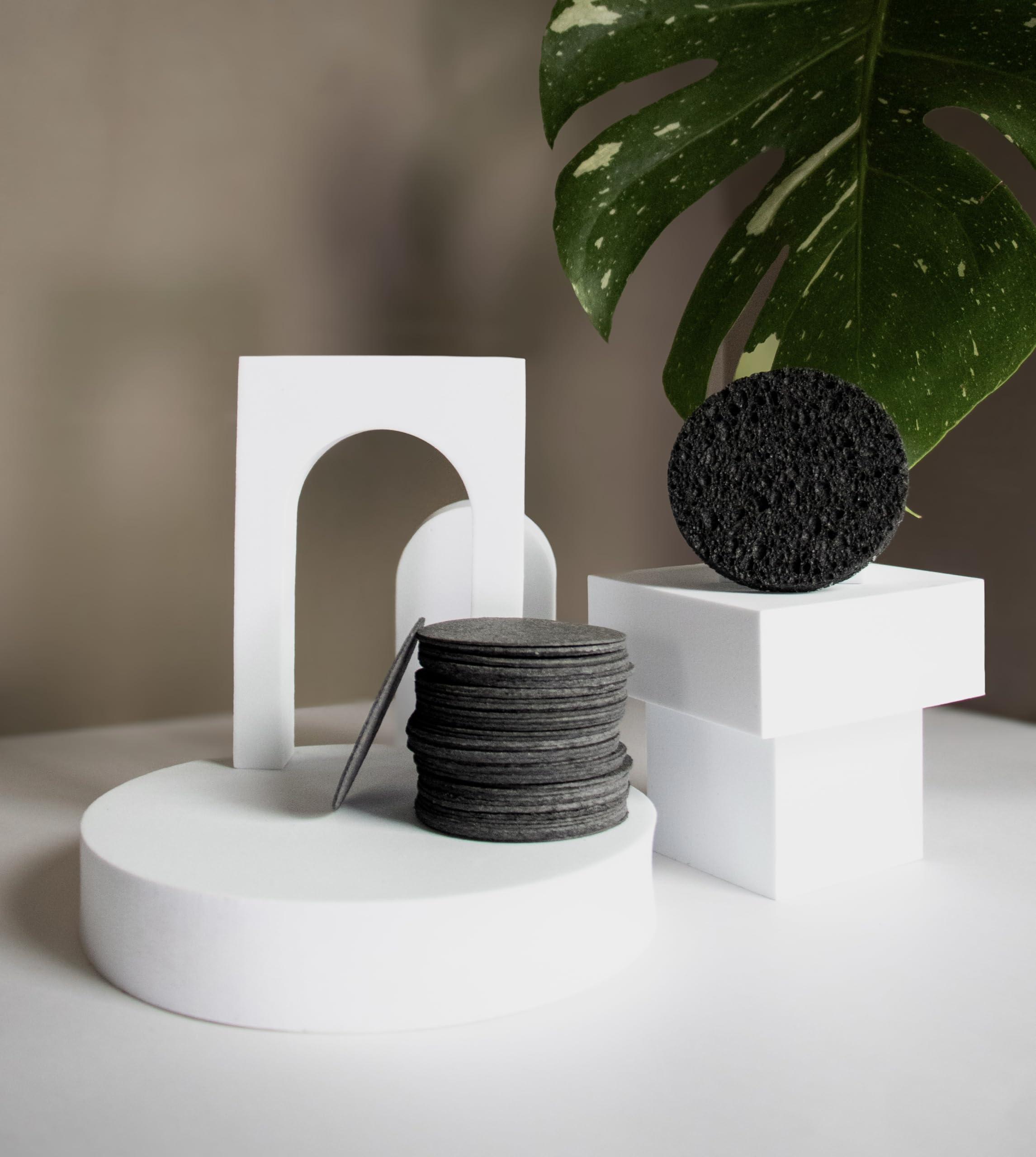 Bamboo Charcoal Cleansing Sponge closeup texture emphasizes porous surface for gentle exfoliation.