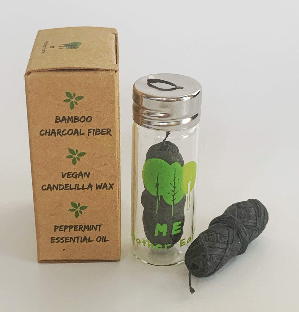 Close-up of bamboo charcoal dental floss