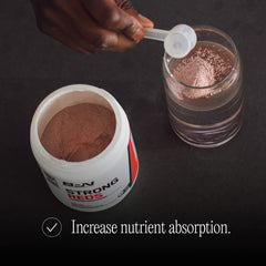 Lifestyle shot of someone mixing BPN Strong Reds into a beverage