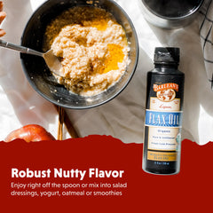 Pouring Barlean's Organic Lignan Flaxseed Oil into a spoon