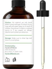 Amber glass bottle of basil essential oil with label
