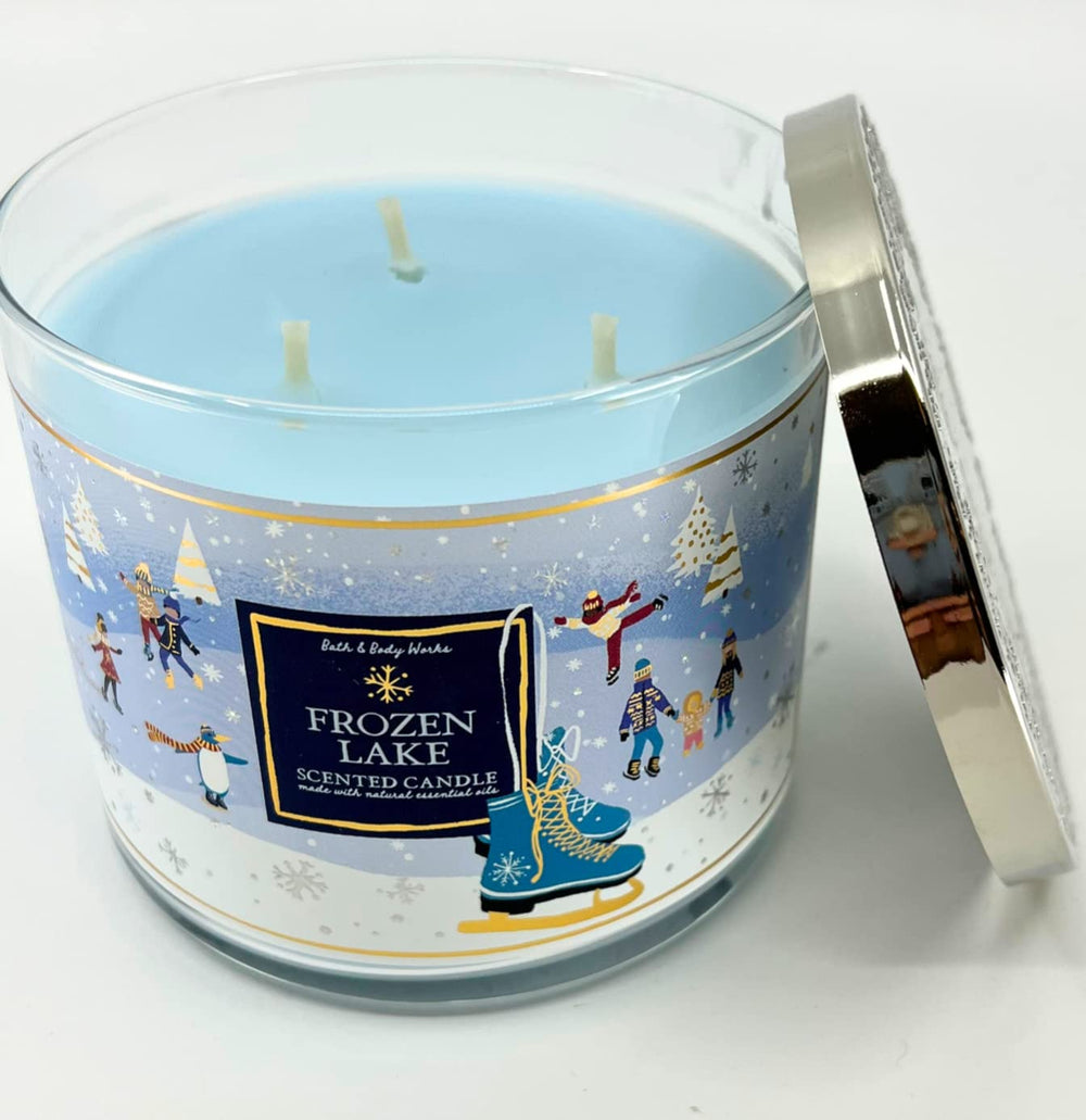 Winter holiday scene with Frozen Lake 14.5 oz candle burning