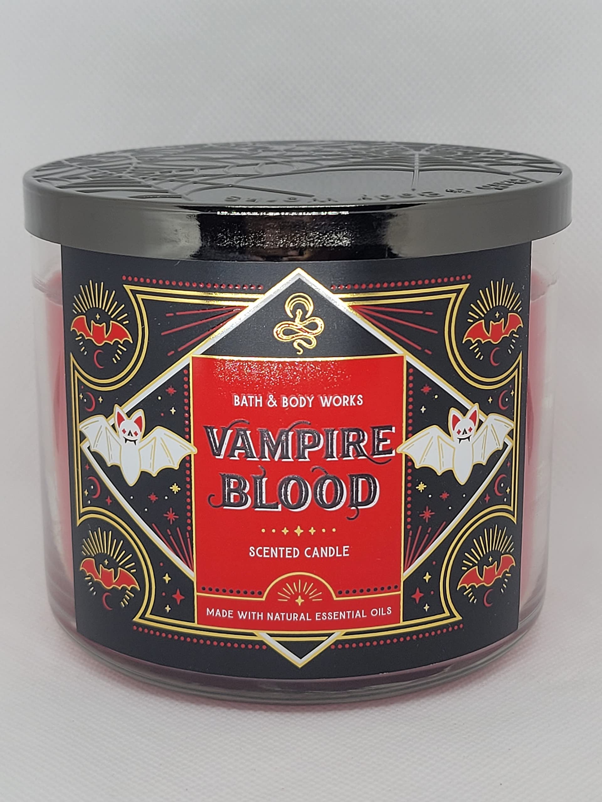 Close-up of glitter embellishment on Vampire Blood candle in red metal jar