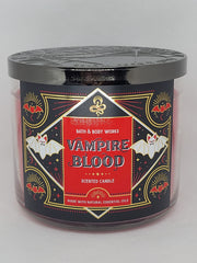 Close-up of glitter embellishment on Vampire Blood candle in red metal jar