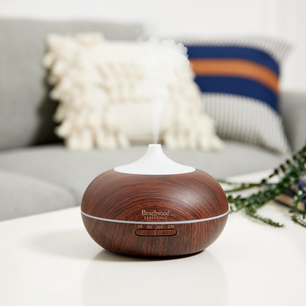 White Beachwood Essentials diffuser placed in a living room
