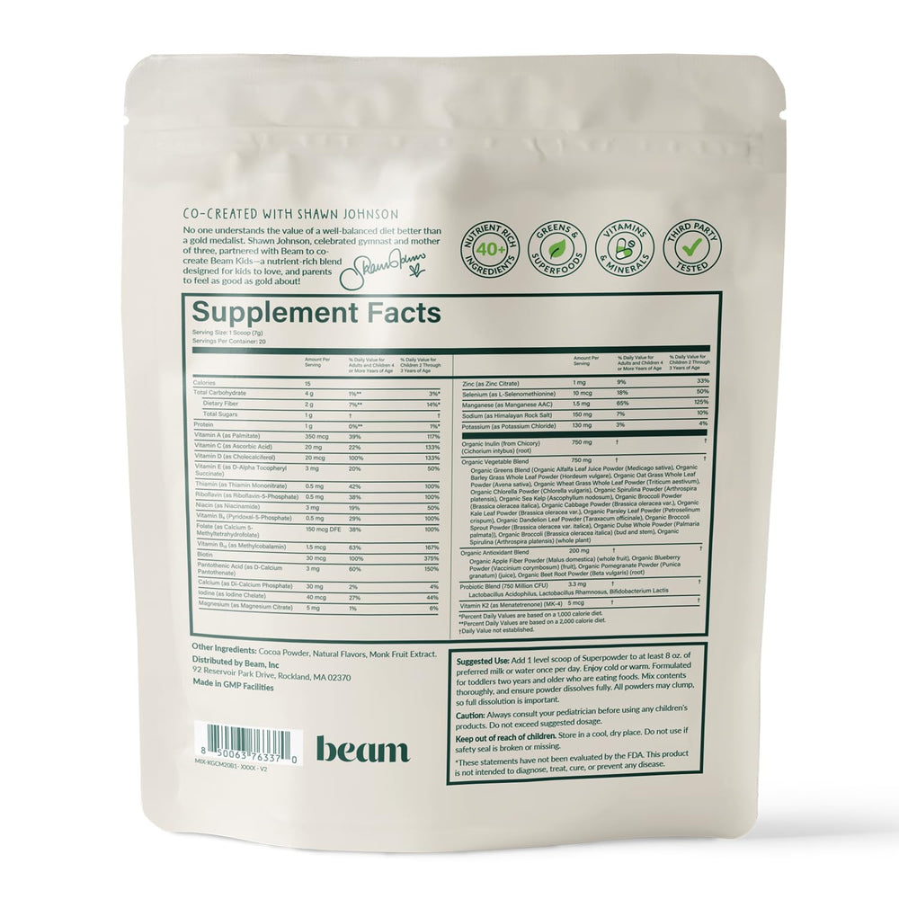 Happy child holding Beam Kids All-in-One Superfood Powder container
