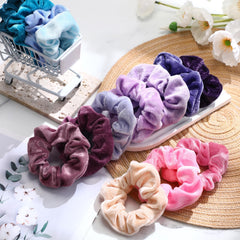 Bememo velvet scrunchies stored in velvet bag for travel and organization.