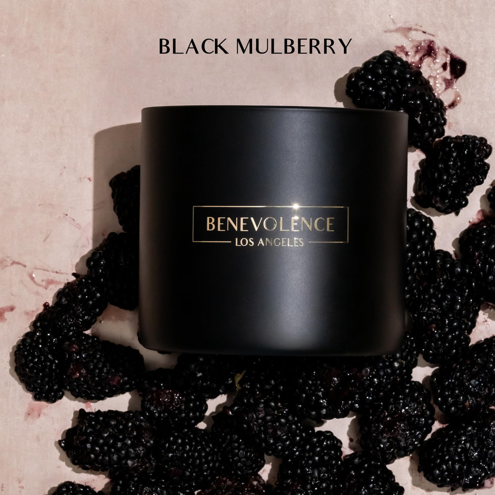 Close-up of black wax candle with Baies fragrance