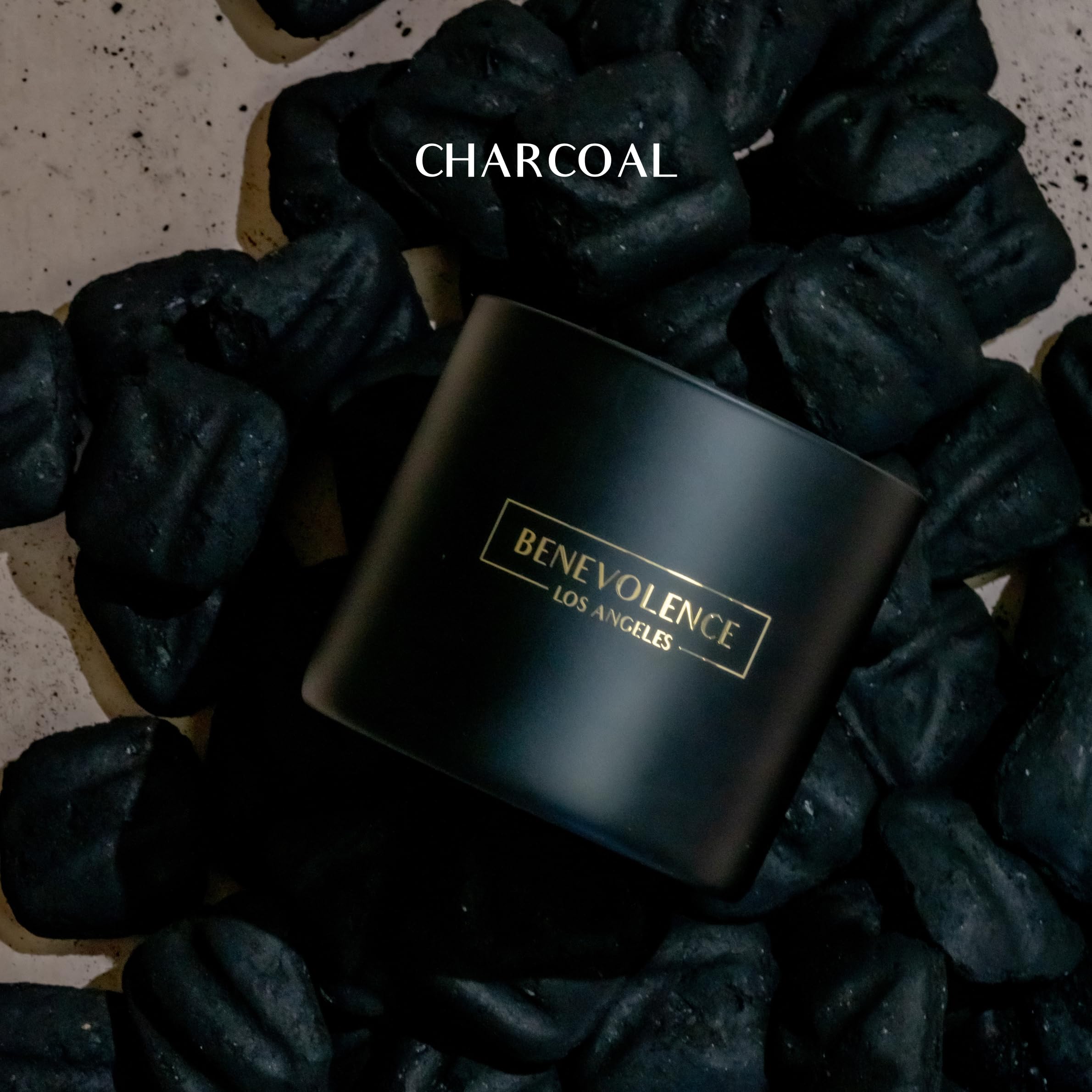 Close-up of black wax 3-wick candle