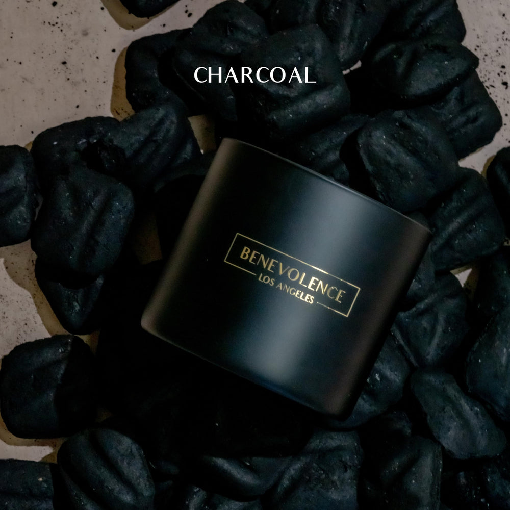 Close-up of black wax 3-wick candle