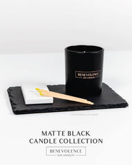 Candle with minimalist holiday packaging and label