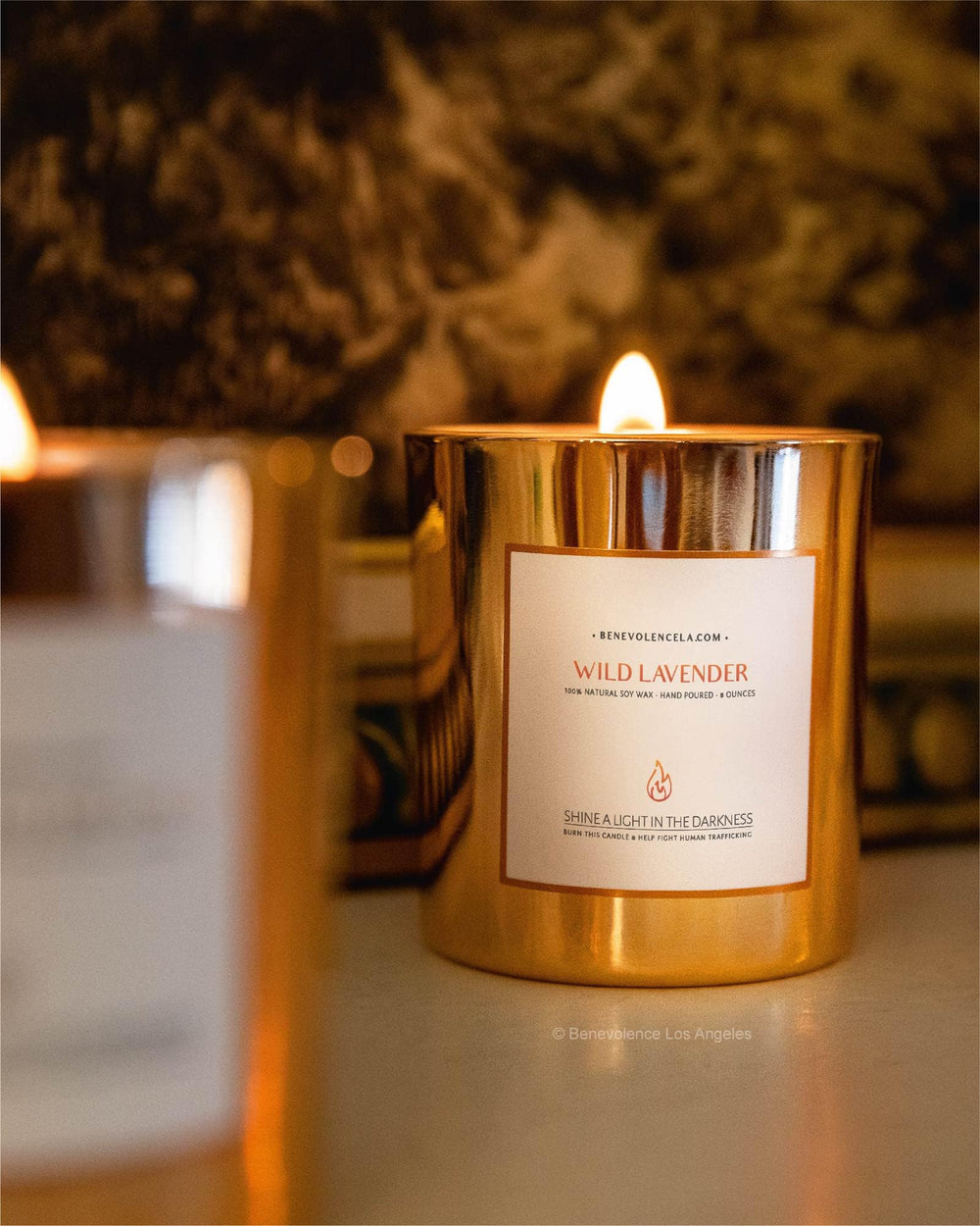 Gift-ready Benevolence LA Wild Lavender candle in a cozy setting