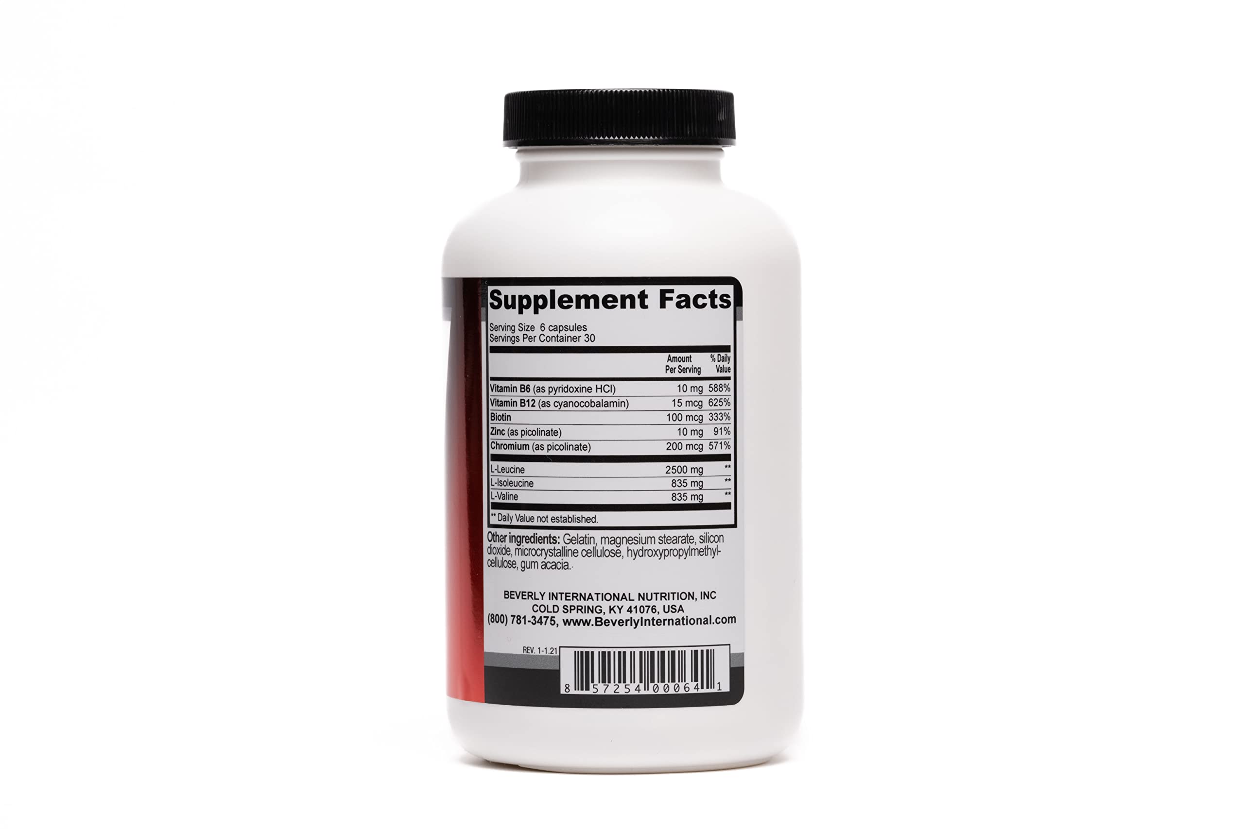 Close-up of Muscularity capsules next to bottle