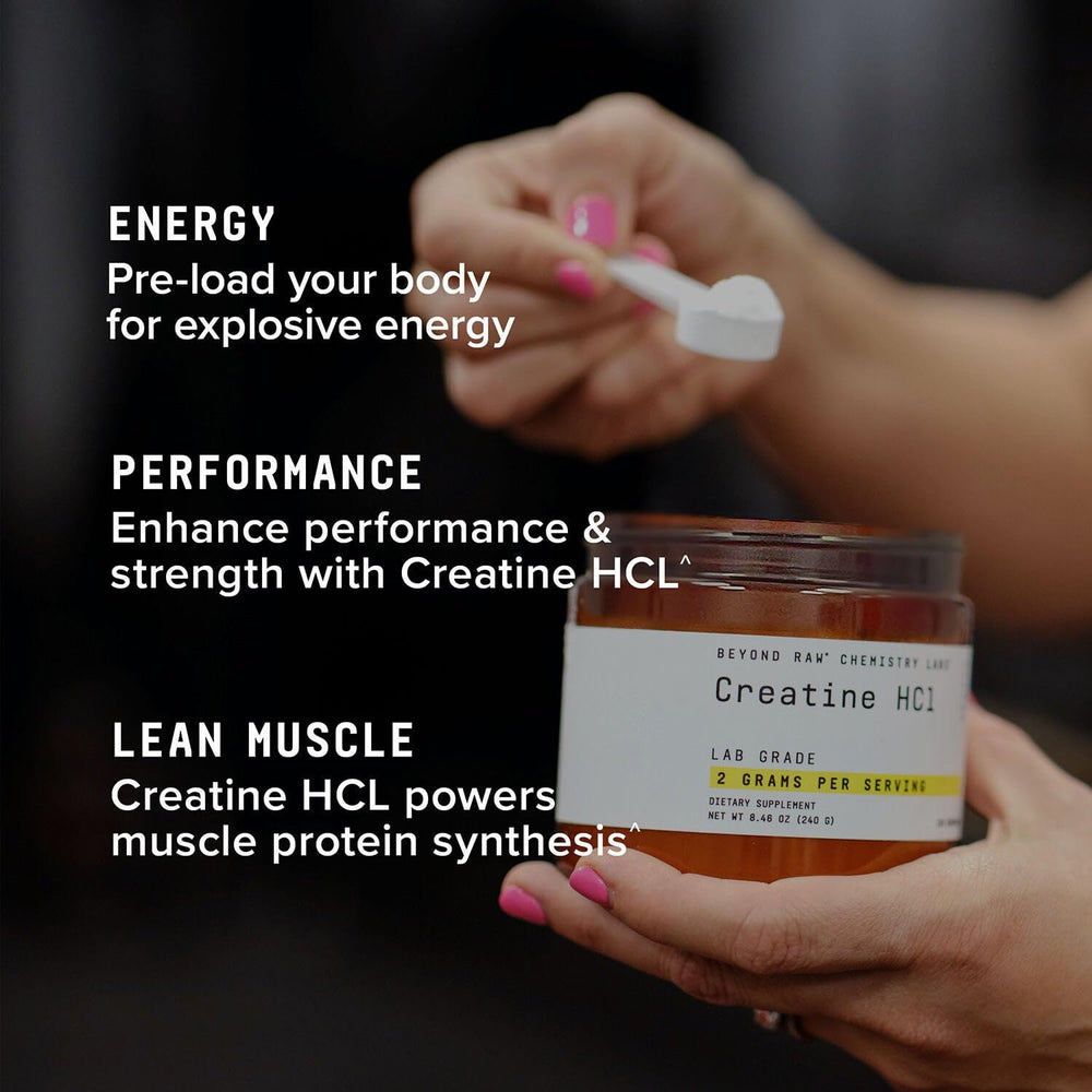 Beyond Raw Creatine HCl powder being poured into a glass before a workout.
