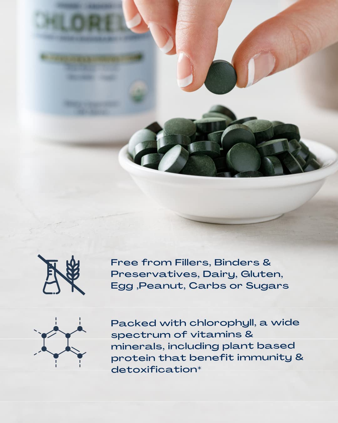 Vegan and Non-GMO icons beside chlorella tablets
