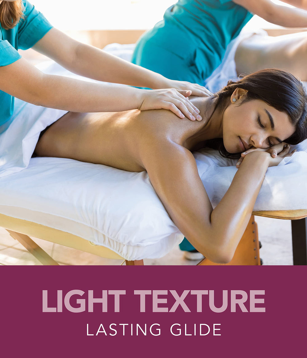 Oil being applied for massage with towels in background