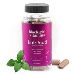 Bottle of Black Girl Vitamins Hair Food Biotin supplement with collagen