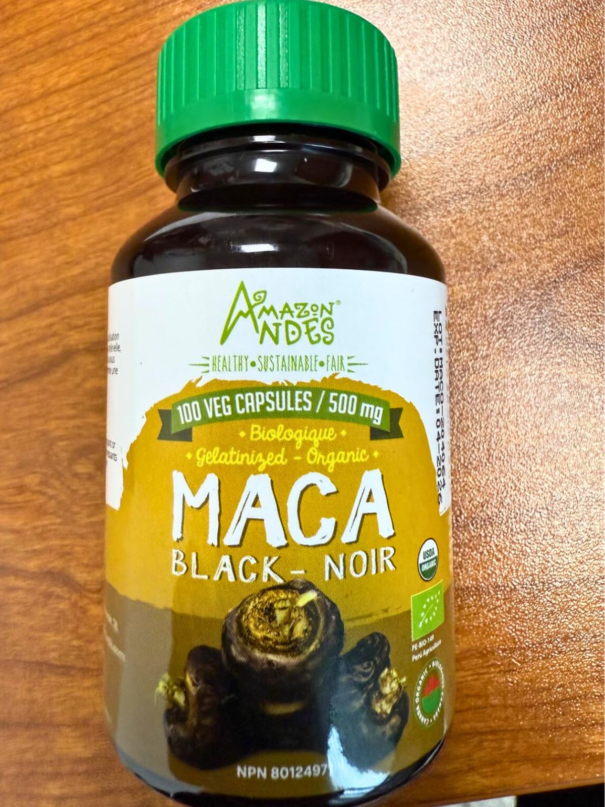 Black Maca Root Capsule and powder on white background