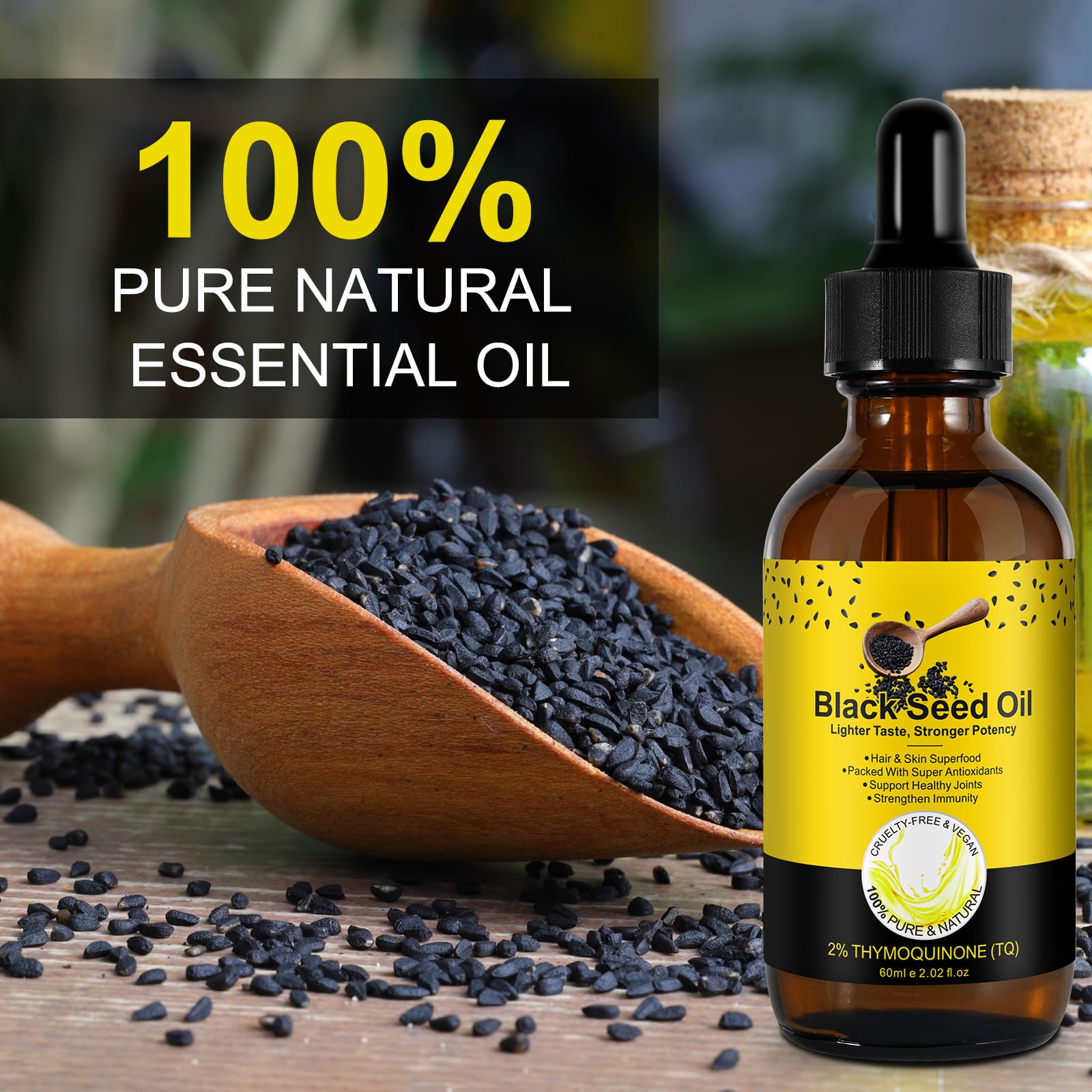 Pouring black seed oil from a dropper