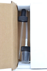 Glass dropper with black seed oil in bottle