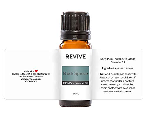 Black Spruce Essential Oil bottle surrounded by skincare and hair care products