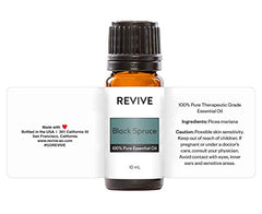 Black Spruce Essential Oil bottle surrounded by skincare and hair care products