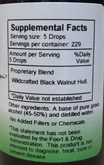 Liquid black walnut extract being dispensed with a dropper