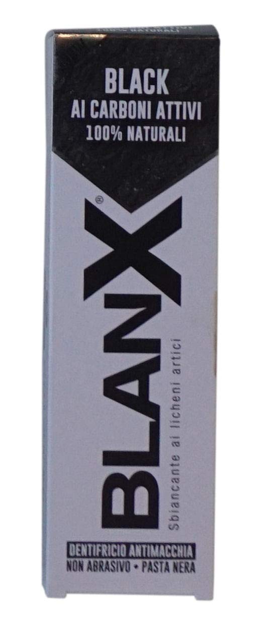 Close-up of Black whitening toothpaste paste with charcoal