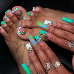 BLGTGH ombre green French tips toenails in long square shape with blue gradient and cherry charm.