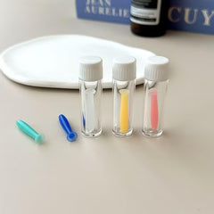 Blue silicone lens insertion tool with handle and suction tip