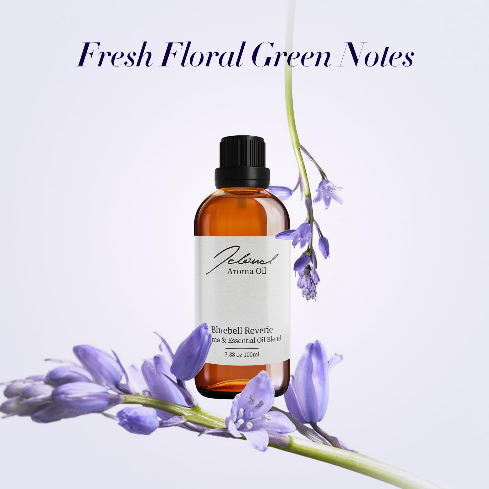 Diffuser oil bottle surrounded by jasmine and amber accents