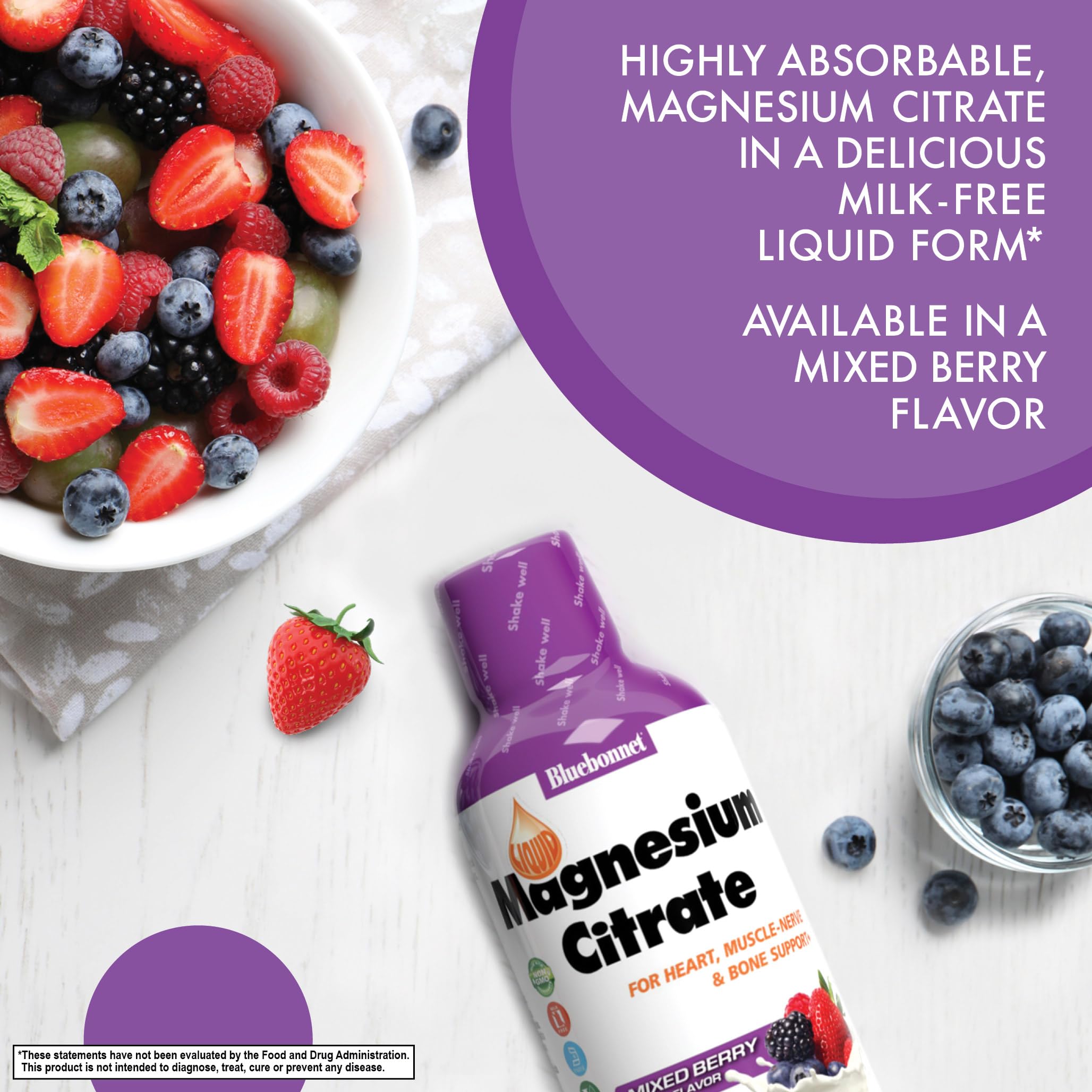 Mixed berry flavored liquid magnesium citrate bottle on white background