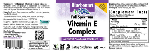 Close-up of Bluebonnet Vitamin E Complex Licaps capsules next to bottle