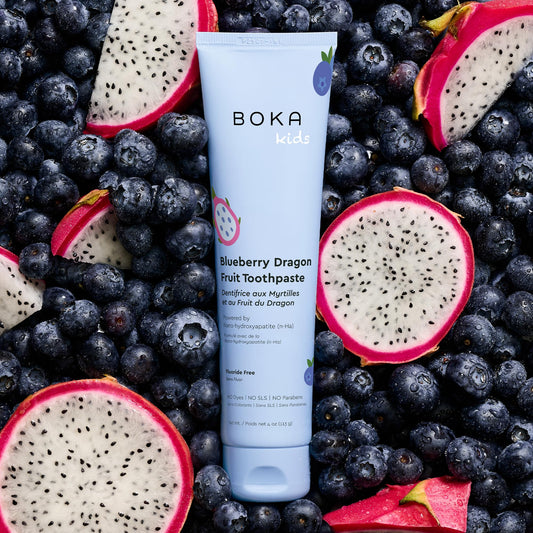 Front of Boka toothpaste tube highlighting nano hydroxyapatite and Blueberry Dragon Fruit flavor, 4 oz