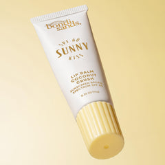 Bondi Sands coconut crush lip balm gloss shot highlights hydration and shine.