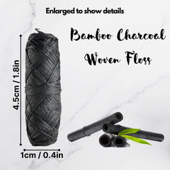Close-up of charcoal infused woven dental floss strands