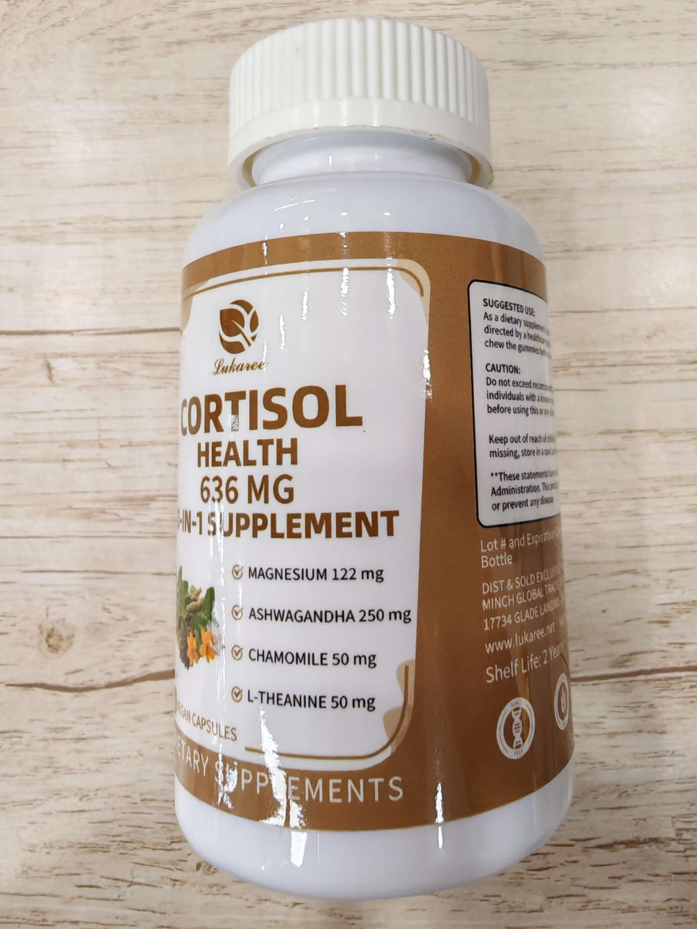 Cortisol supplement bottle displayed on wood background