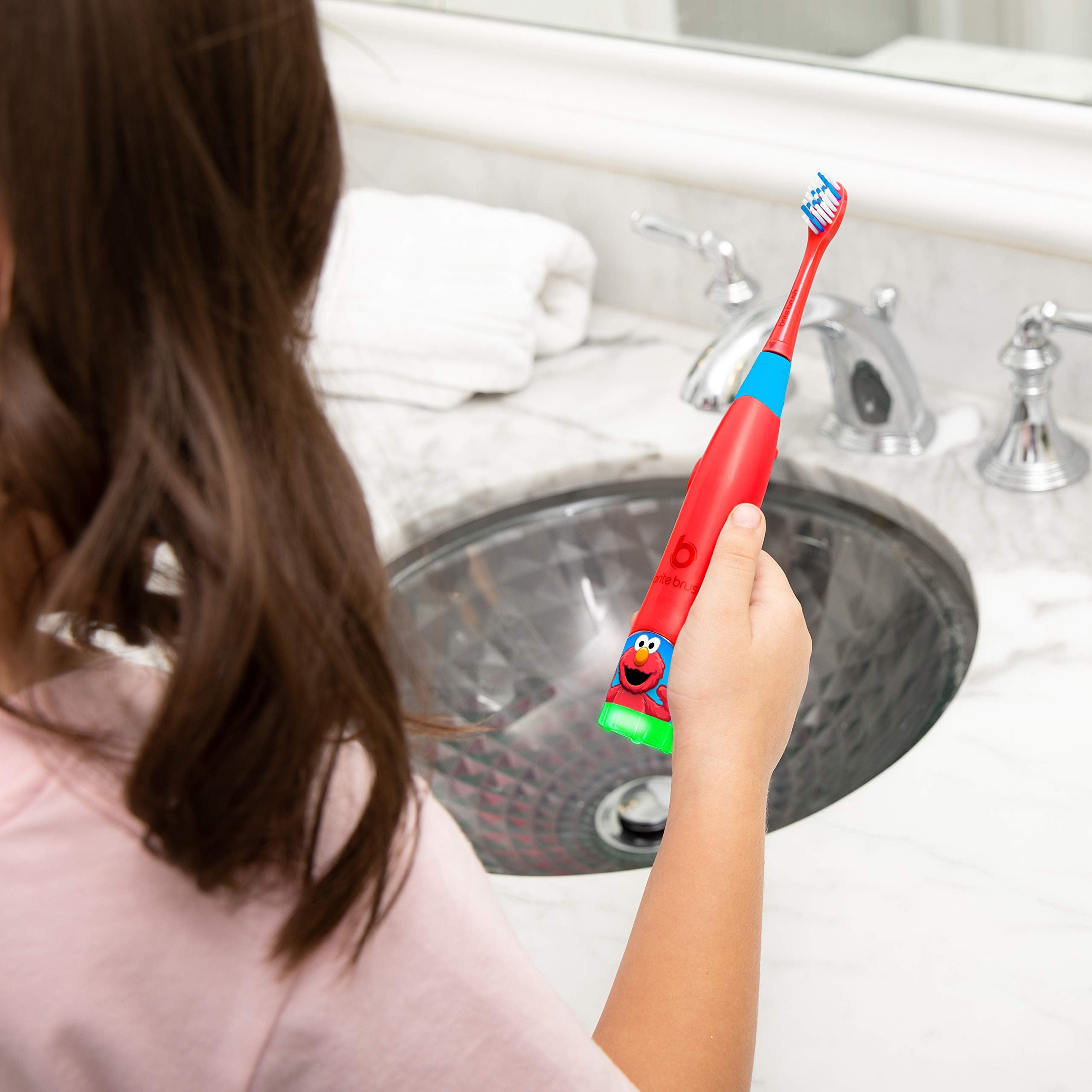 BriteBrush packaging featuring Elmo and awards
