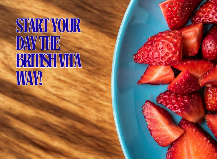 Blue plate with strawberries on a wooden surface, promoting 'The British Vita' brand.