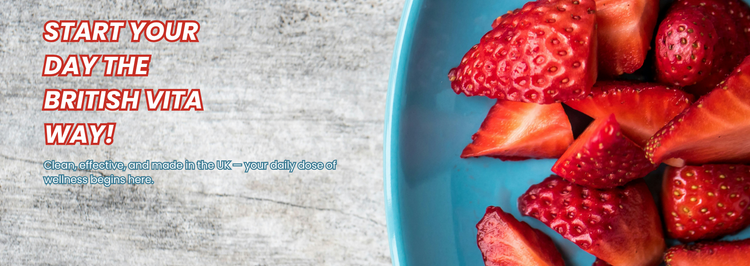 Blue plate with strawberries on a wooden surface, promoting 'The British Vita' brand.