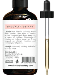 Close-up of amber bottle of Spearmint Essential Oil