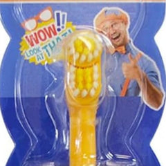 Close-up of Blippi-themed children's electric toothbrush in bright colors