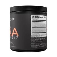 Glass of mixed Bucked Up BCAA in water showing clear dissolve for convenience