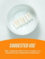 Creatine monohydrate capsules and bottle close-up