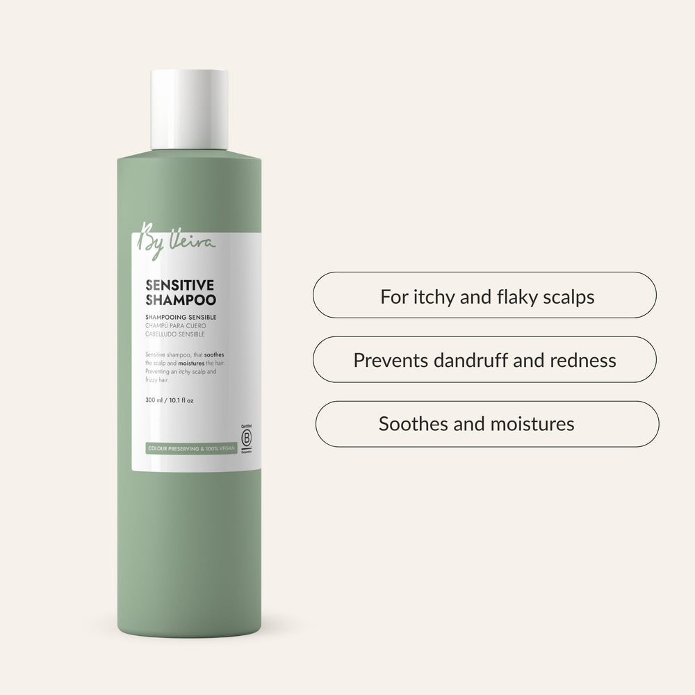 Creamy lather on damp hair hints at moisture and frizz control.