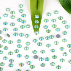 Heat-activated glue on Bymitel rhinestones enables quick application with a hotfix tool.