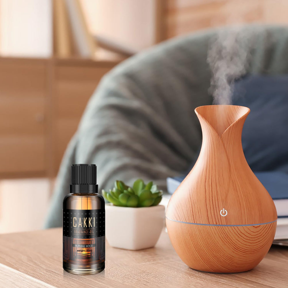 Close-up of Cakki Scent-Burning Wood diffuser oil bottle 50ml