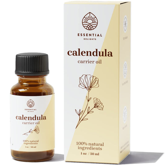 Calendula oil bottle with fresh calendula flowers