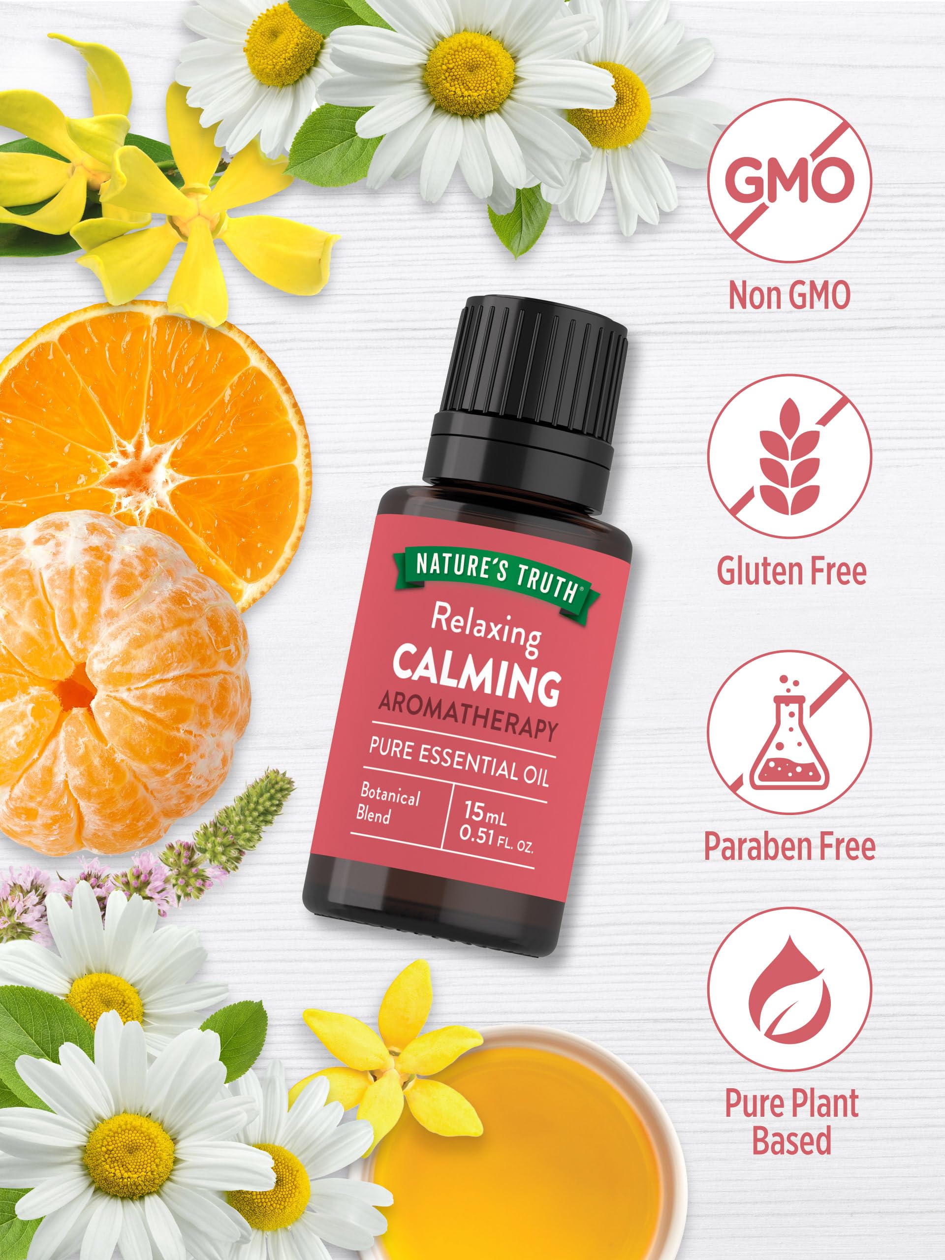 Close-up of calming essential oil ingredients: orange, tangerine, ylang-ylang, patchouli, chamomile